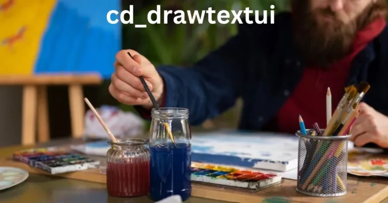 a person painting a jar with blue liquid